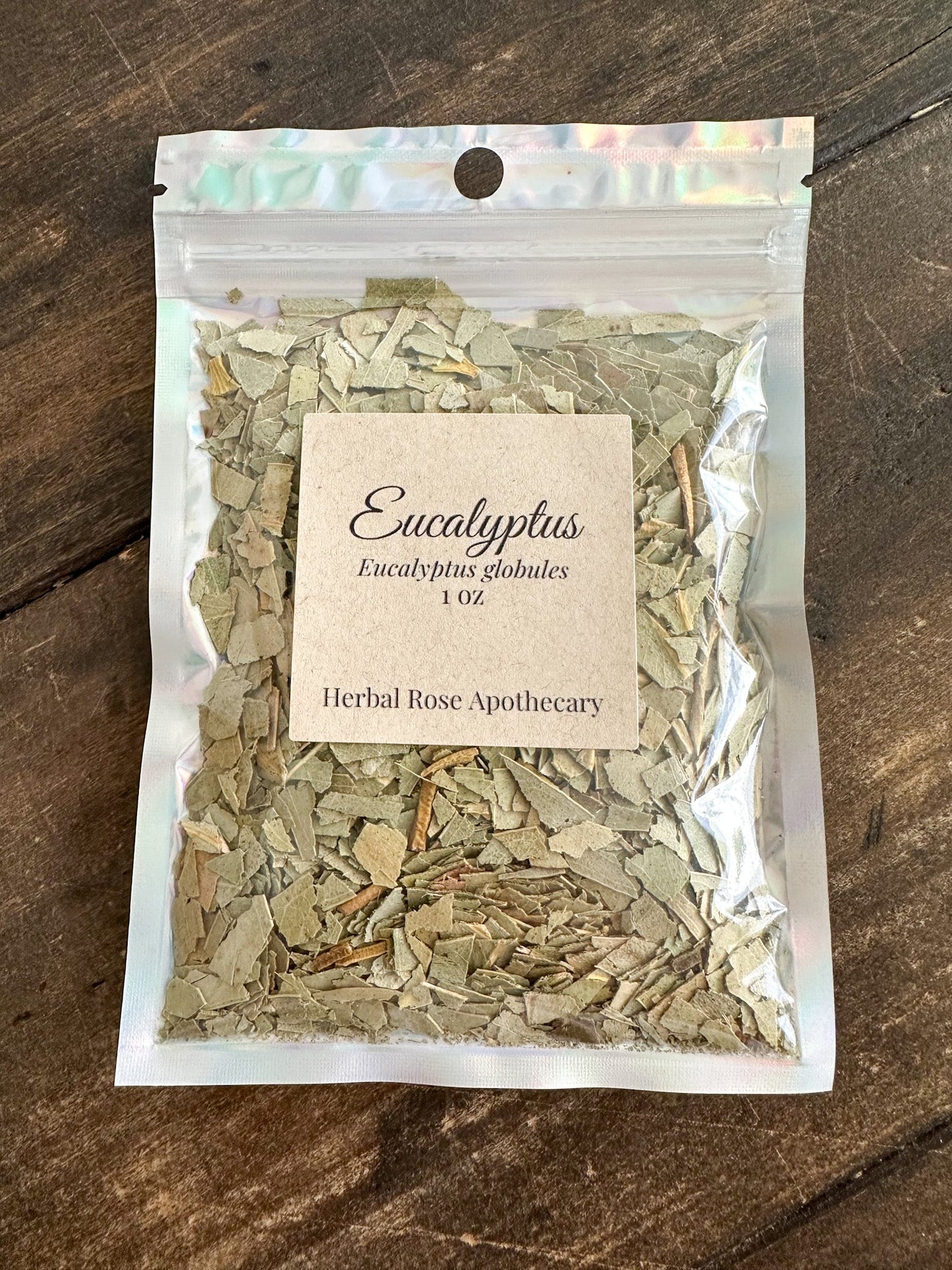 Organic eucalyptus leaf flakes in clear foil pouch, herb pieces visible through