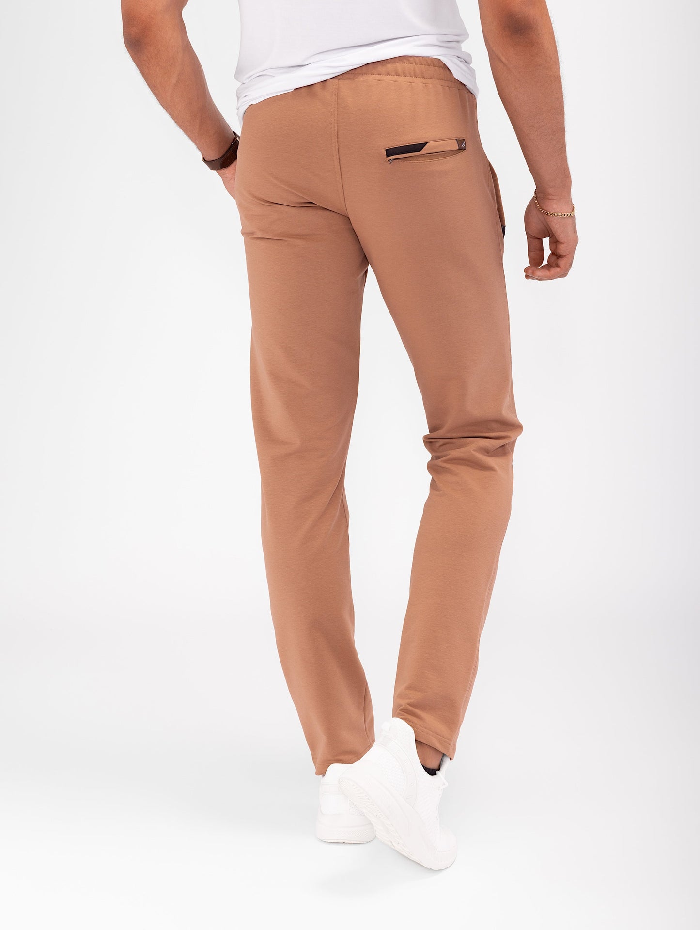 Rust brown tapered athletic sweatpants with back yoke and pocket detail