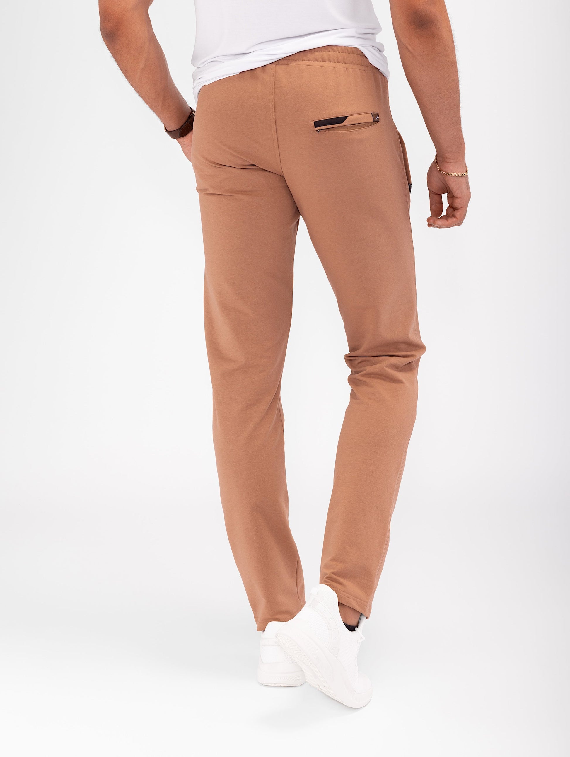 Rust brown tapered athletic sweatpants with back yoke and pocket detail