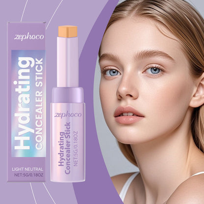 Zephco hydrating concealer stick, light neutral shade, angled close-up, lavender tube and orange cap