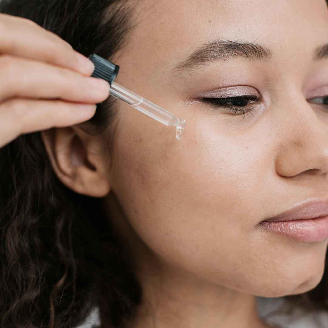 Oil applied under the eye using a dropper applicator