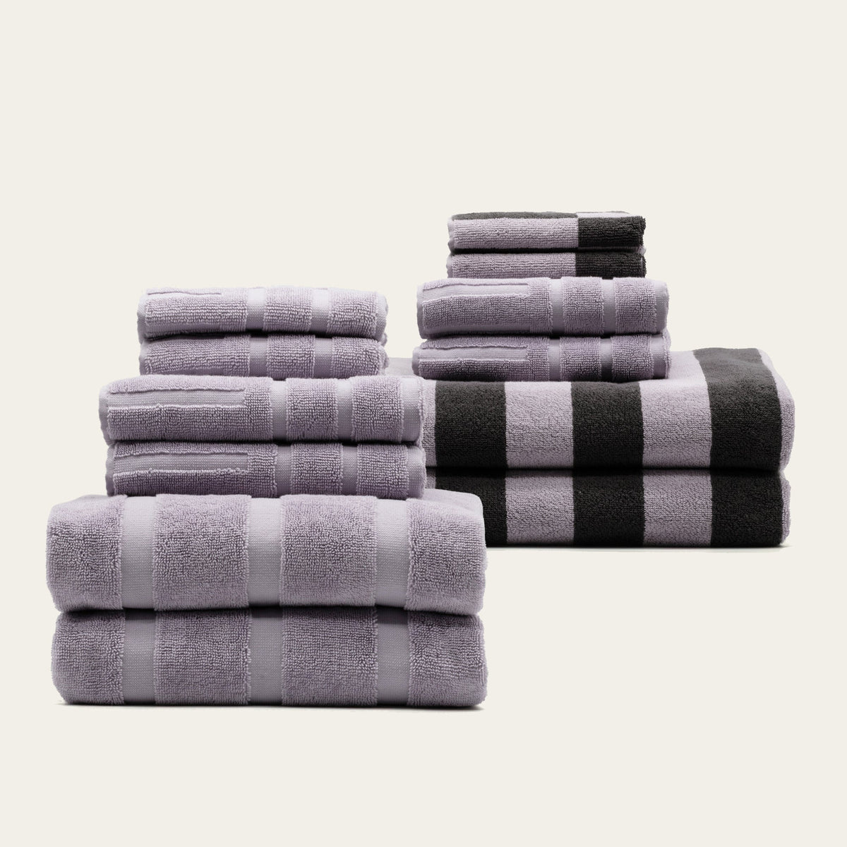 Cotton towel set in lilac, folded terry towels with horizontal stripe bands
