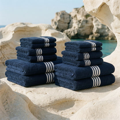 Navy cotton towel set with white striped borders, stacked in pairs.