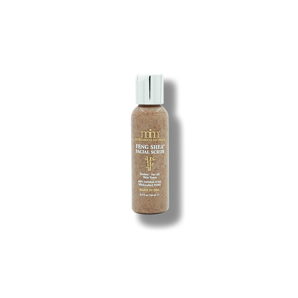 Feng Shea facial scrub bottle with brown liquid and white cap, angled view