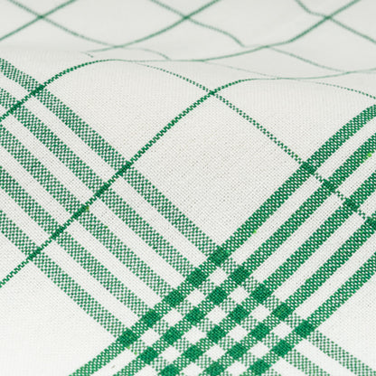 Close-up of white kitchen towel fabric with green windowpane grid stitching