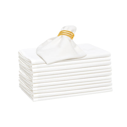 Flour sack napkins, white, neatly stacked with gold ribbon tie