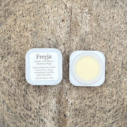 Freyja scented balm jar with square lid and pale yellow cream inside