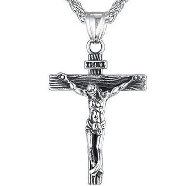 Silver crucifix necklace with detailed figure and chain