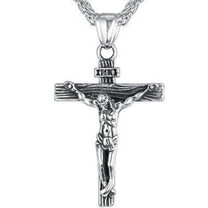 Silver crucifix necklace with detailed figure and chain