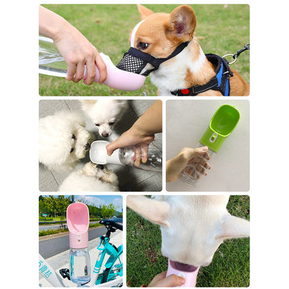 Pet dog water feeder bottle, pink and green shown in use with dogs