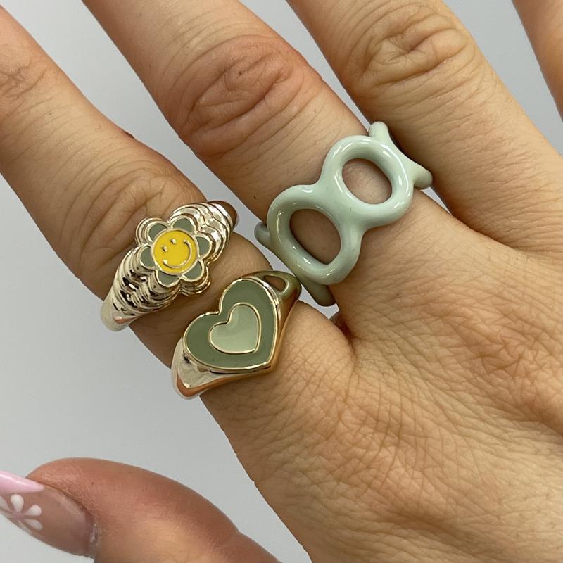 Heart enamel ring with teal heart face on gold-tone band