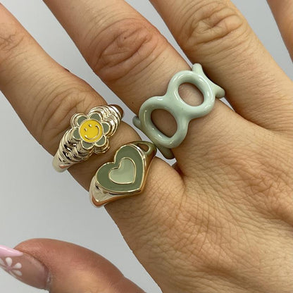 Heart enamel ring with teal heart face on gold-tone band
