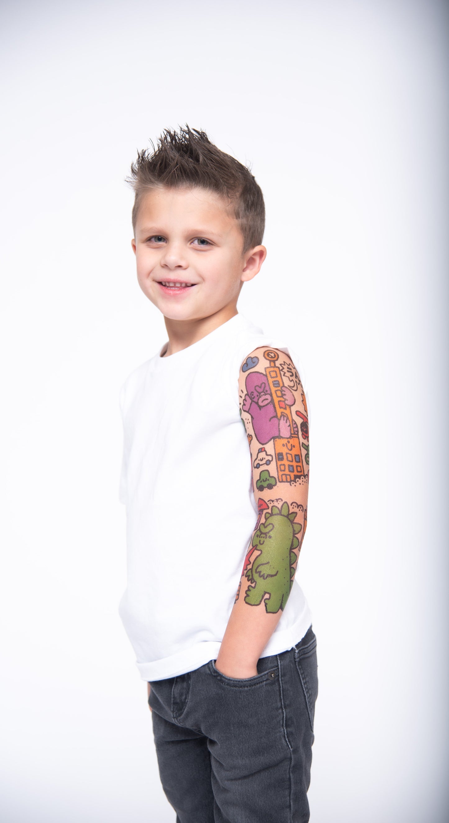 Temporary kids tattoo sleeve on boy’s left arm with colorful city buildings