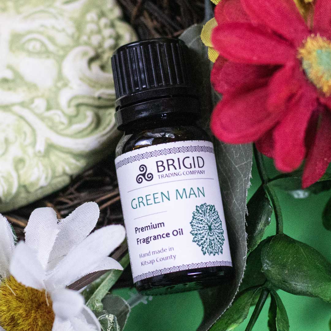 Essential oil blend bottle Green Man with black cap and white flowers