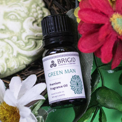 Essential oil blend bottle Green Man with black cap and white flowers