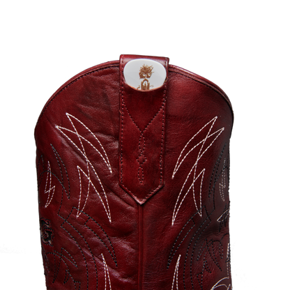 Single red guitar pick with tree graphic and Alvies logo