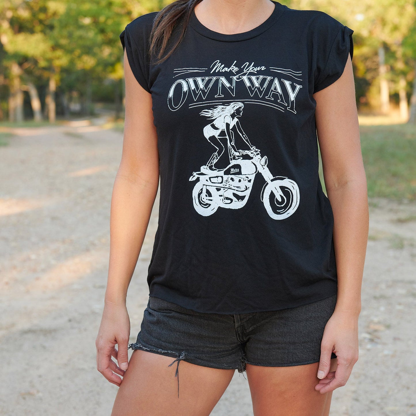 Black muscle tee worn by model, front motorcycle rider logo graphic