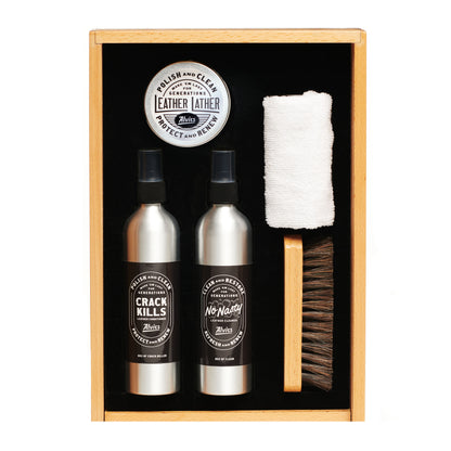 Boot care kit in wooden box with leather protectant bottles, cloth and brush