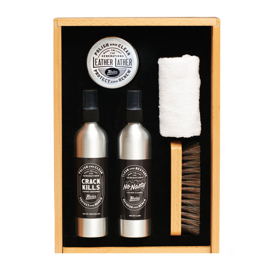Boot care kit in wooden box with leather protectant bottles, cloth and brush
