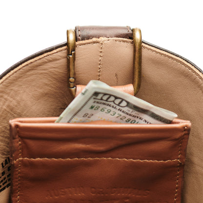 Brown leather boot mule with brass buckle and tan lining; cash in front pocket
