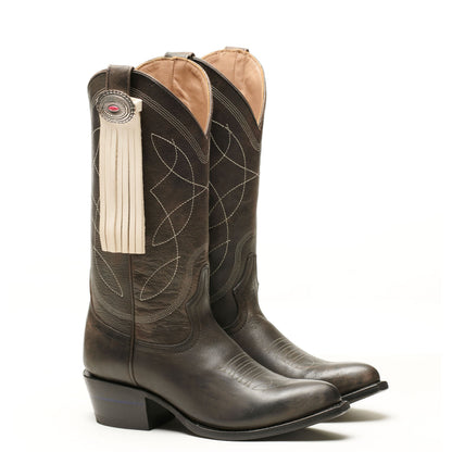 Dark brown leather western boot with long tassel fringe and round concho badge