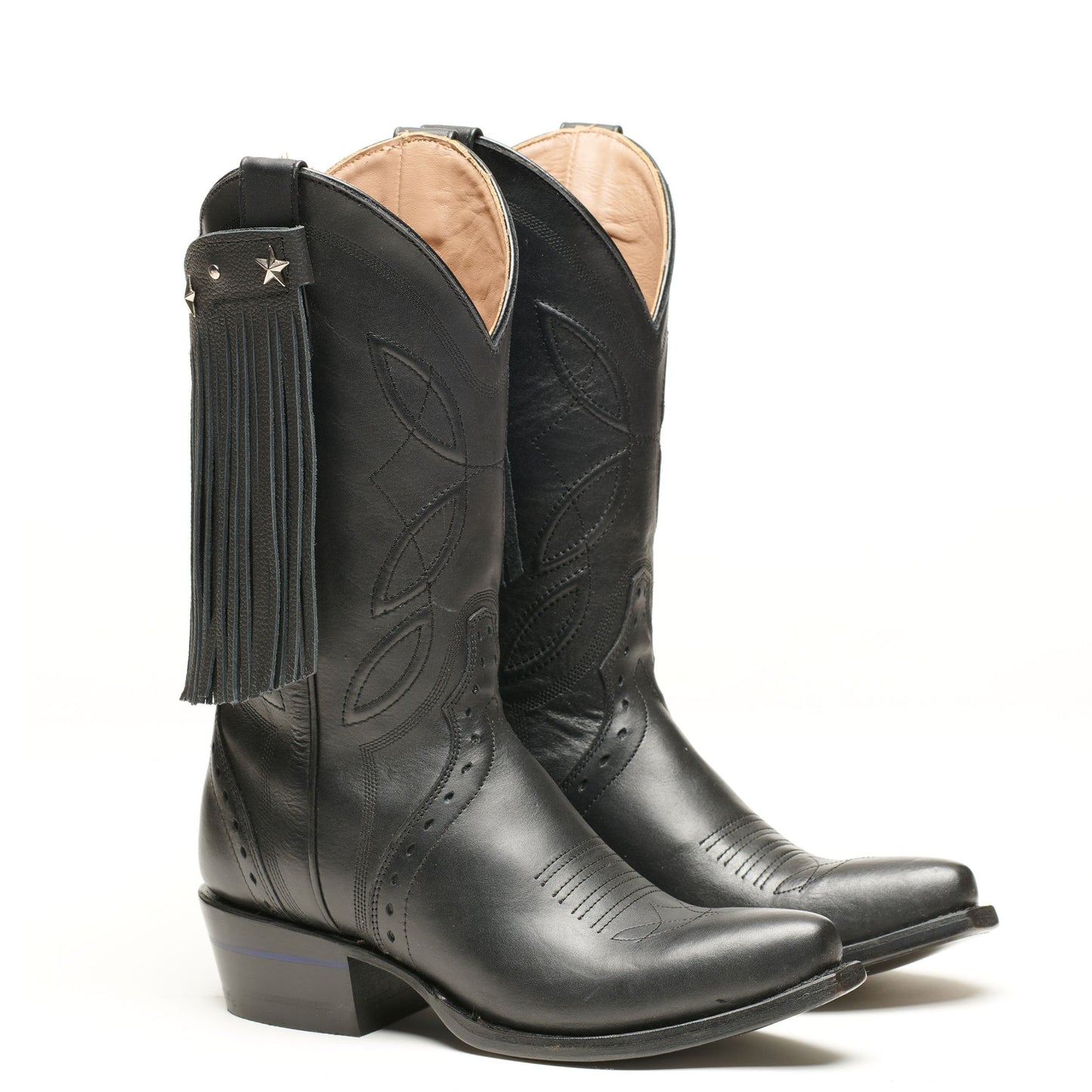 Black cowboy boots with pointed toe, star stitching, and fringe shaft