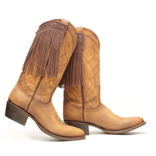 Brown fringe cowboy boots with pointed toe and low heel, quilted shaft detail
