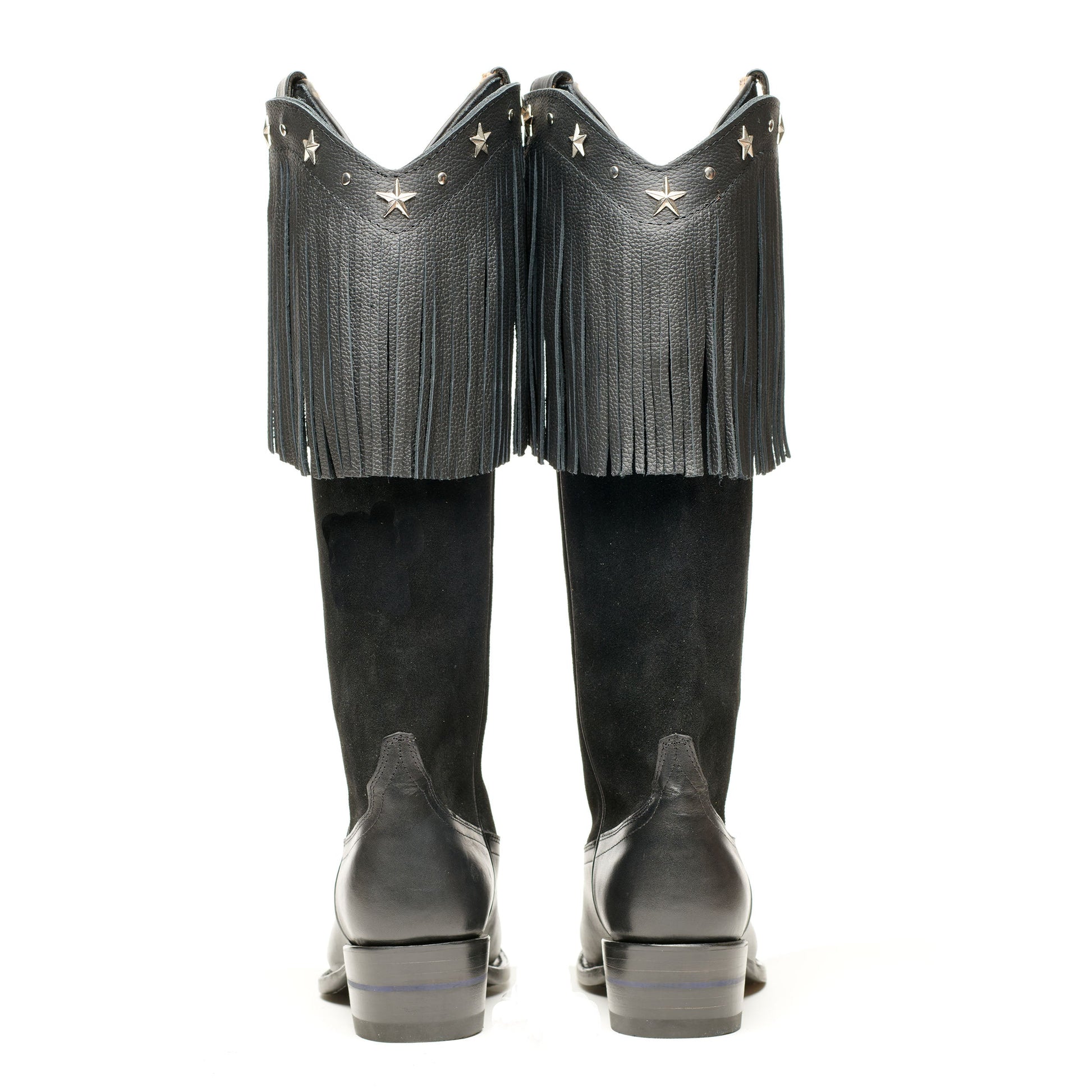 Black cowboy boots, back view, with long fringe and star accents on tops