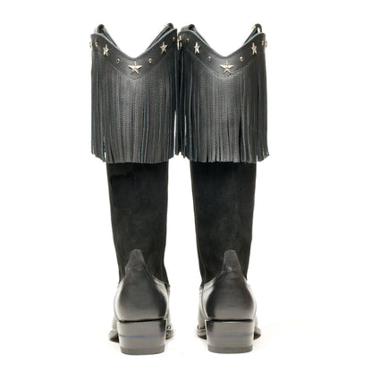 Black cowboy boots, back view, with long fringe and star accents on tops
