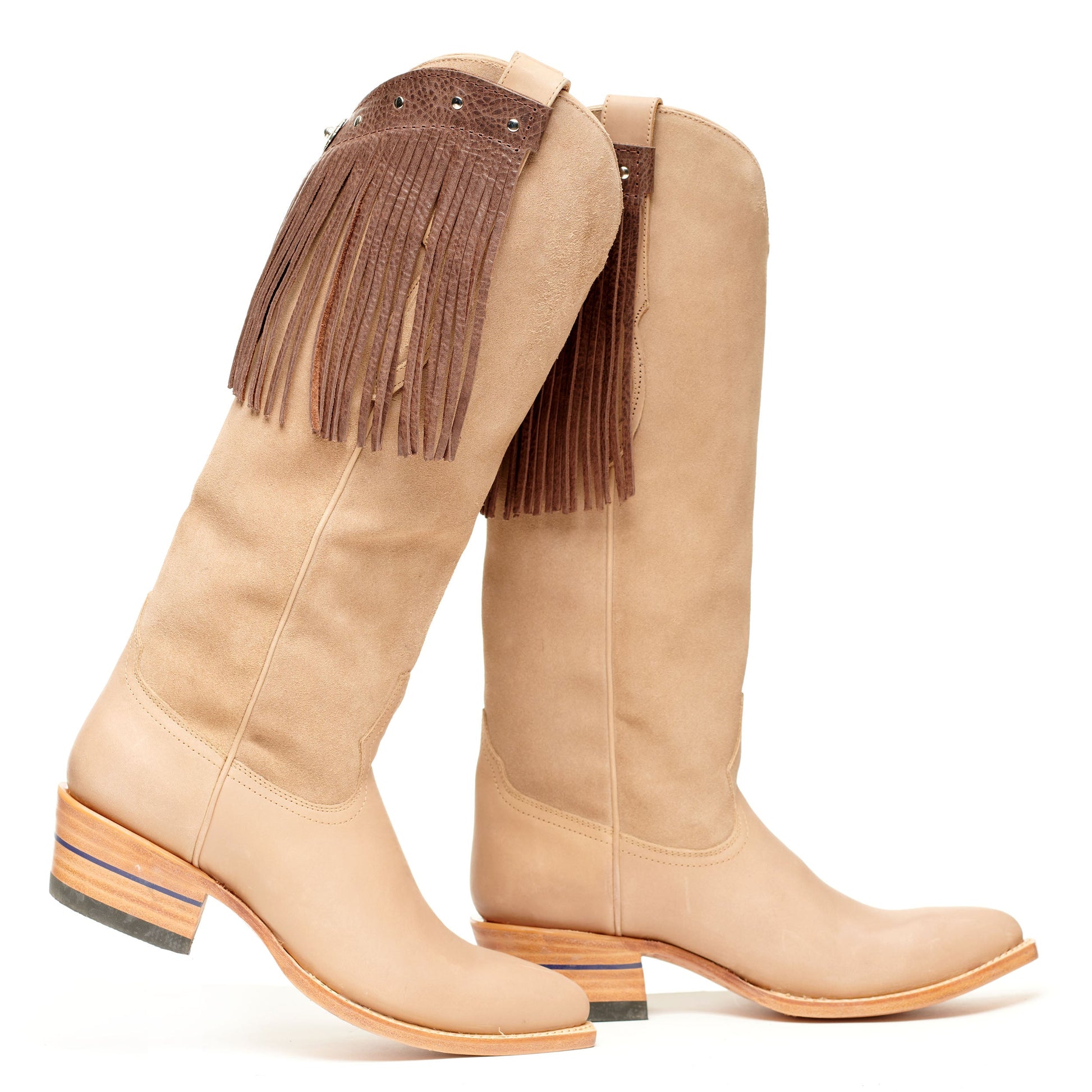 Light tan fringe cowboy boots with pointed toe and stacked block heel