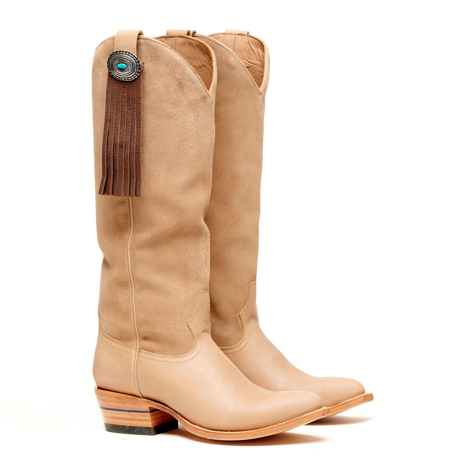 Beige cowboy boots with suede fringe tassel detail and concho medallion