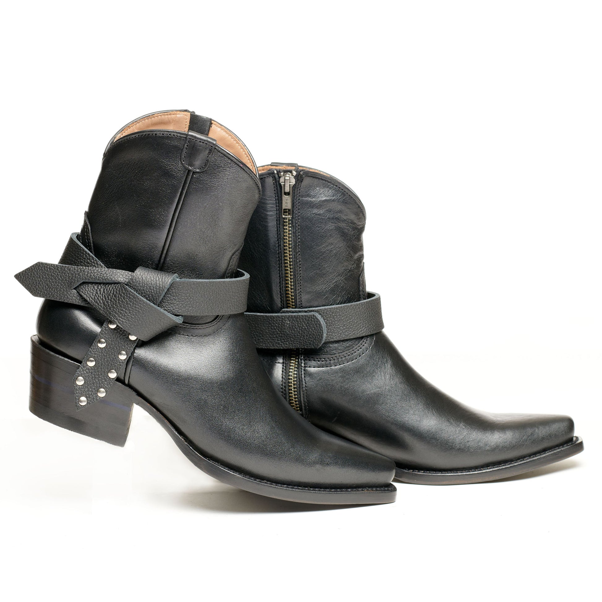 Black ankle boot with wrapped strap detail and studs on side