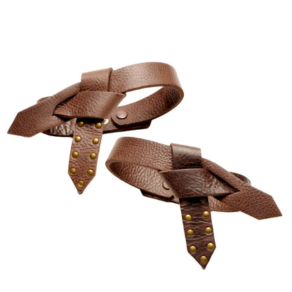 Boot knot pair, brown leather boots with bow knot straps and gold stud accents