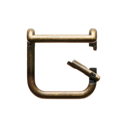 Gold boot pull clip with metal handle bar and spring-loaded latch.