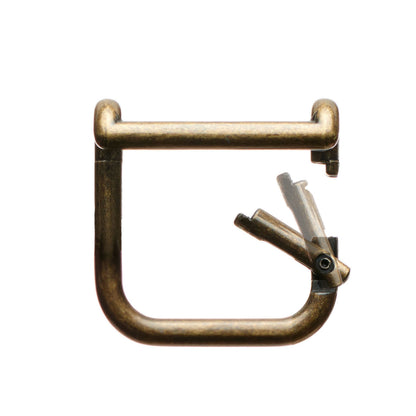 Gold boot pull clip, metal U-shape with spring latch and arrow graphic.