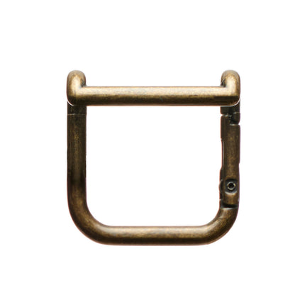 Boot mule metal clasp detail with U-shaped ring and hinged bar lock