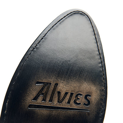 Black leather boot interior with stitched edge and embossed logo