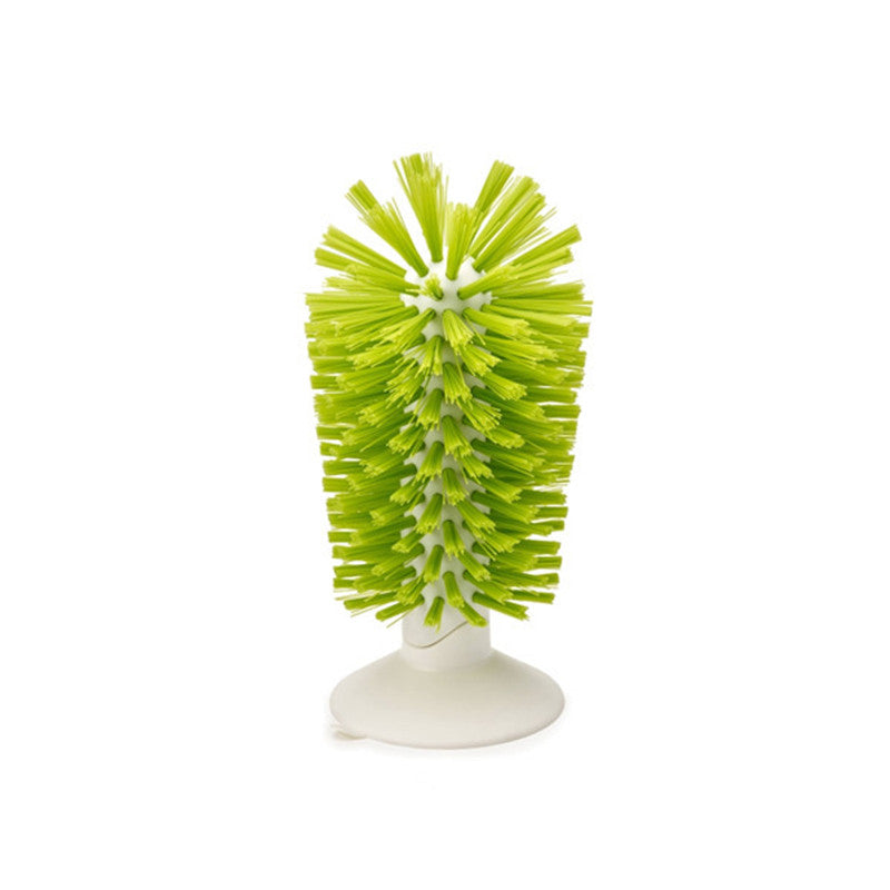 Standing bottle brush with bright green bristles on white base
