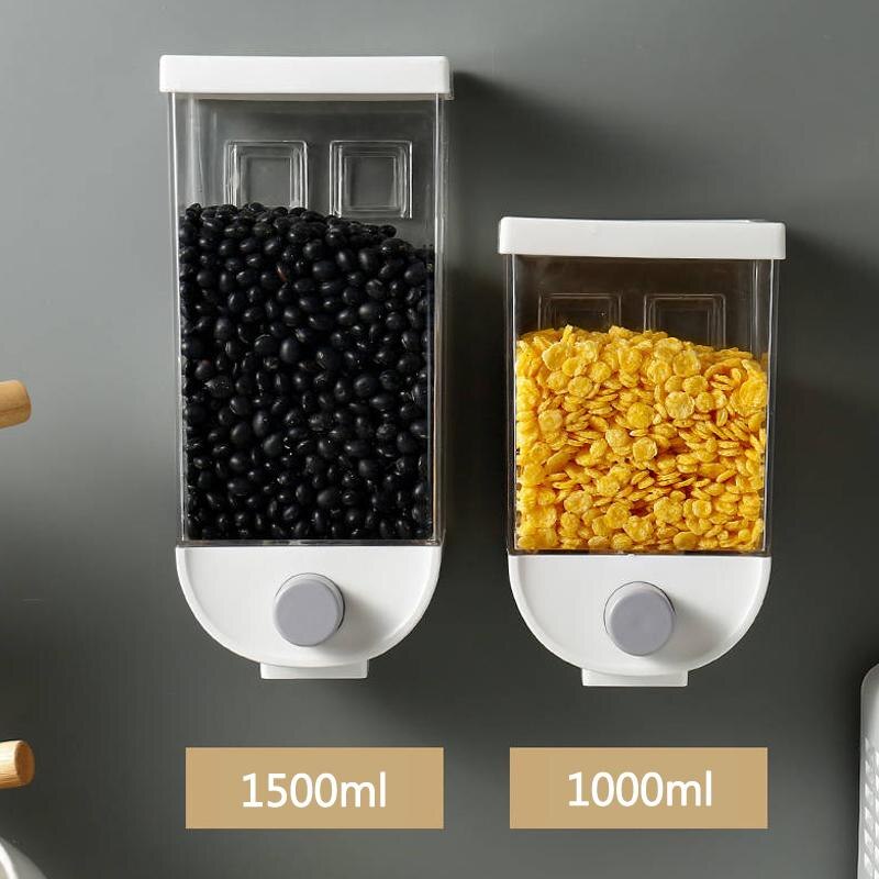 Wall-mounted kitchen sealed grain jars, two white dispensers with dark and yellow kernels