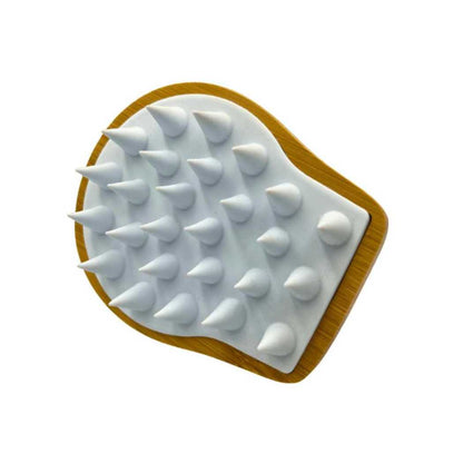 Hair and scalp massaging brush with white massage nubs on wooden head