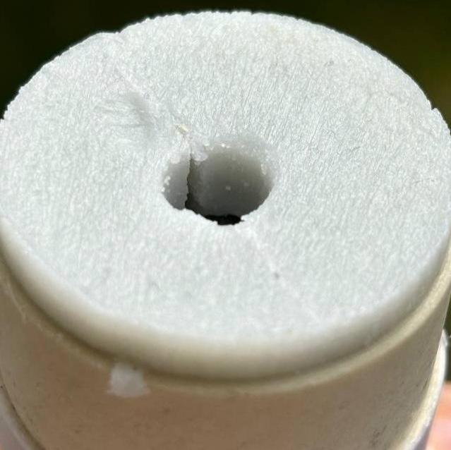 Tallow deodorant stick top showing exposed product through central opening