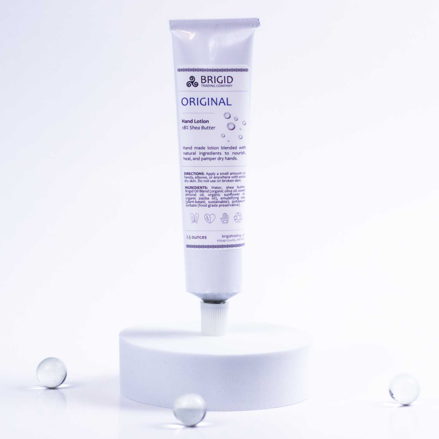 BRIGID hand lotion tube front view on white pedestal