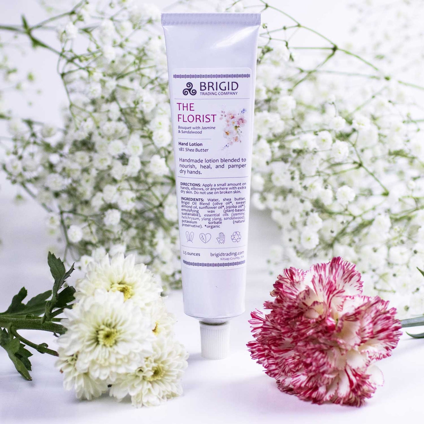 Natural hand lotion tube, white with purple top; BRIGID label on front