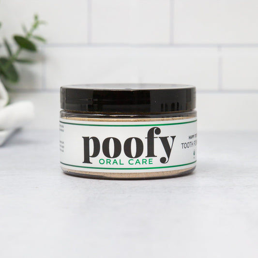 Tooth powder jar with black lid, white label, Poofy Oral Care branding