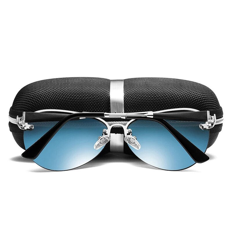 Men’s sunglasses with blue mirrored lenses and silver frame resting on a case