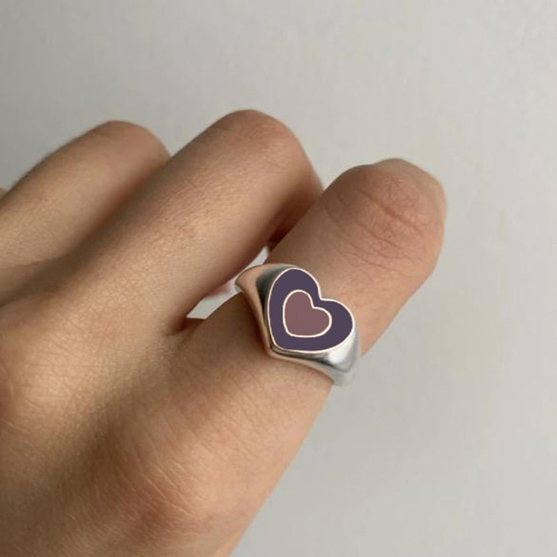 Heart enamel ring with dark blue center and silver-tone bezel