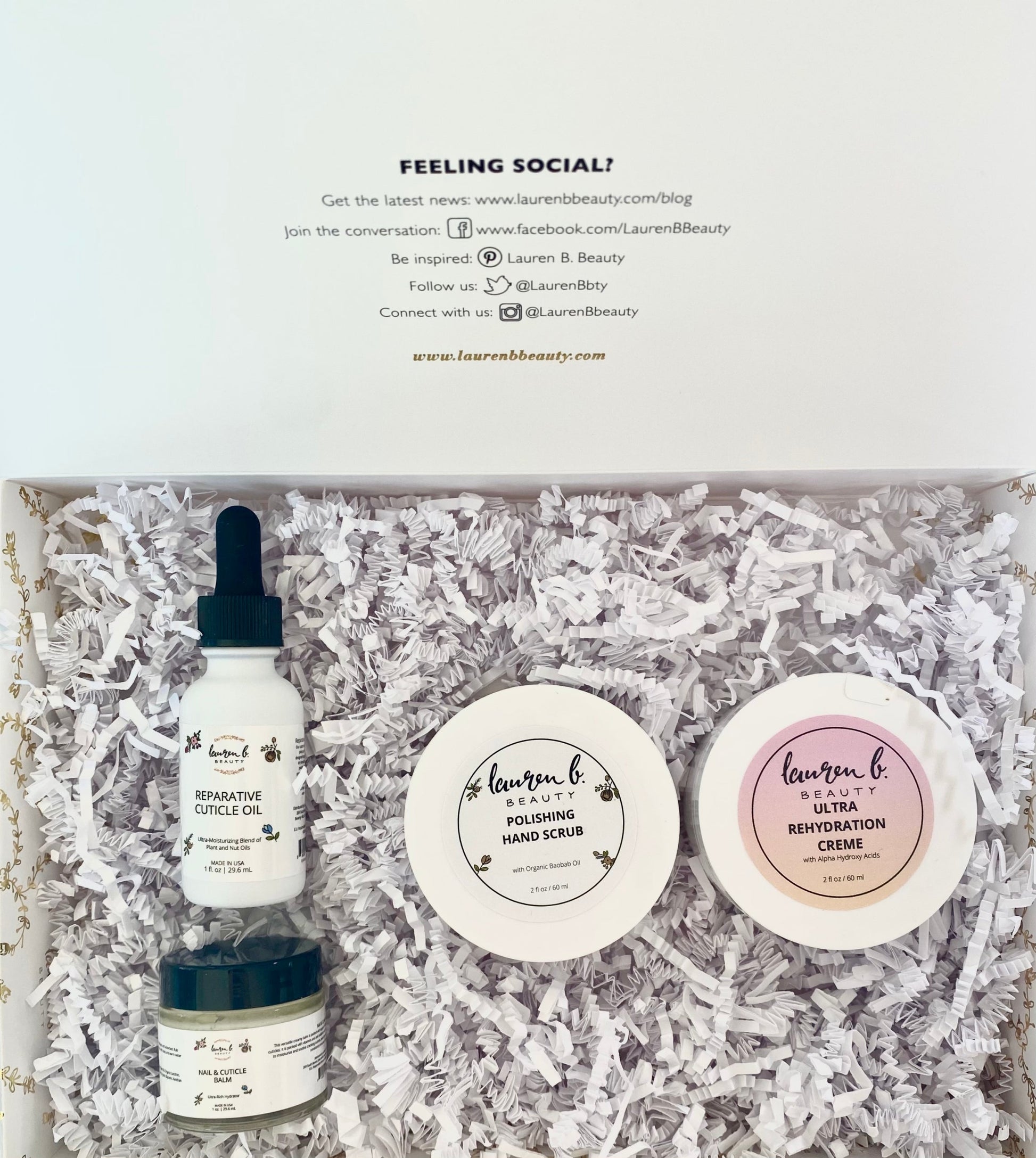 Hand care gift set in a box with mini bottles and jars