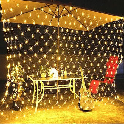 Net mesh solar fairy lights with warm white glow draped overhead