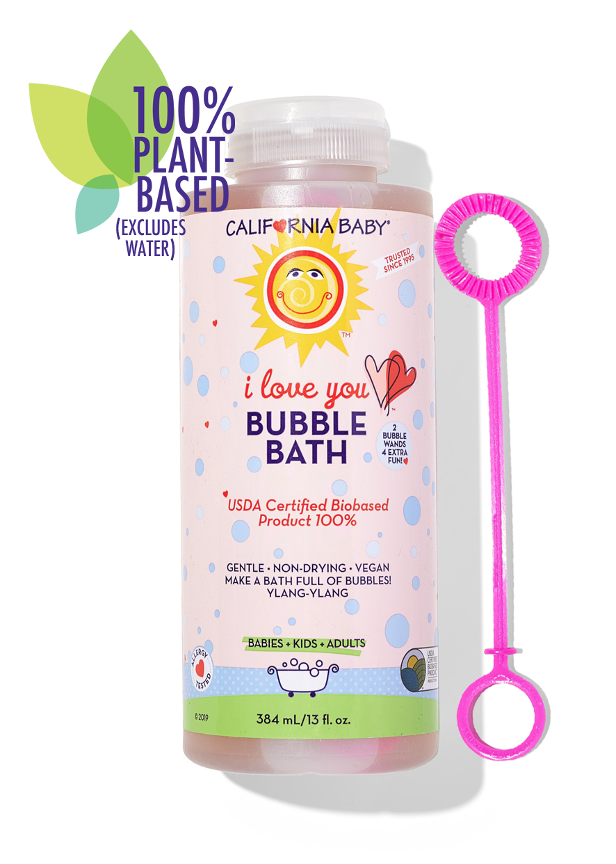 Bubble bath bottle with pink bubble wand, pink liquid, colorful label