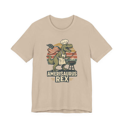 Tan graphic dinosaur T-shirt with grill, text 'Amerisaurus Rex'.
